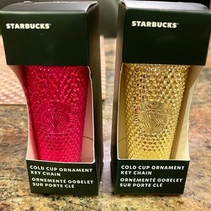 Two Starbucks pink and gold key chains sold as a pair